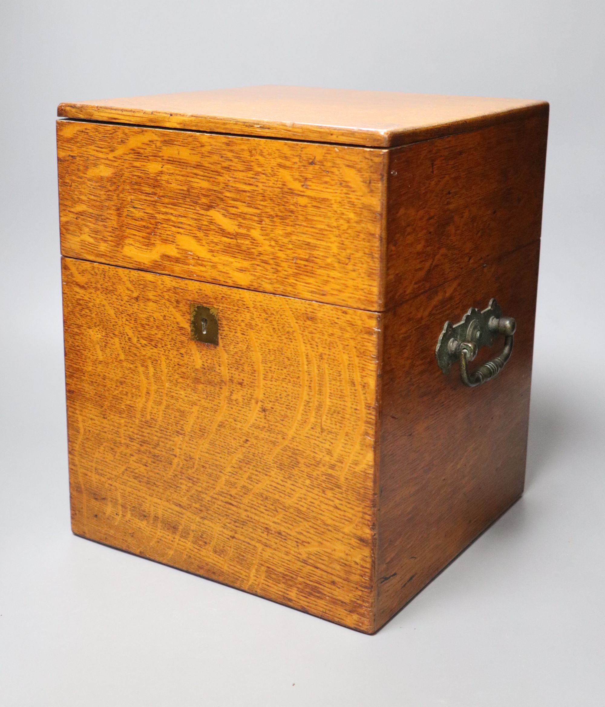 A Victorian oak four decanter box containing two pairs of cut glass decanters, overall height 30cm